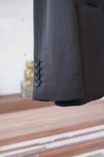 Fendi/25SS autumn and winter new suit suit suit 🫑🫑 Two piece trendy and fashionable suit, a must-have item for business elite wardrobes, men's formal wear, fashionable and trendy wear, brand classic logo logo logo super generous, classic styles will be released every quarter! Wearing the pattern is really great, strongly recommended!Sharp and ergonomic tailoring, with a tall and handsome upper body, simple and elegant. Comfortable and slim fit, showcasing a gentlemanly demeanor at a glance. Made from carefully selected suit fabrics, including 20% wool, 18% viscose, 58% polyester, and 4% spandex, the fabric feels soft and delicate, with good luster and elasticity. The waist is made of sheepskin and leather, and is adorned with Louis Vuitton's soul logo embossed with letters! The silhouette and waist cinching add more comfort to the dressing of stylish men, making them look slim yet handsome!Used for making high-end professional and business formal suits, renowned worldwide for its classic and solemn design style. A high-end business casual suit set that requires high craftsmanship, takes a long time to make, and can be worn all year round!The fabric is flat, with a smooth and full texture, and a firm appearance. It is made of high-quality cotton wool material, and the quality of the material is visible when tied tightly.Regarding details: The high-end suit is cut with a modern feel, combining traditional cutting art with modern production techniques. It adopts fully imported automatic cutting pieces, with almost zero error in each piece of fabric, and then hand sewn by top tailors to ensure the fit and beauty of every part. The front two layers are saved, and according to the principles of ergonomics, it is slim fitting but not tight fitting. The elastic of the cow tendons on both sides of the waistband of the trousers can be adjusted! Not wearing tight waists!Classic collar design, classic style without conservatism, simple and elegant. The lining of the collar is made of pure handmade tribute needles, and we insist on hand sewing handicrafts, all of which are from the hands of experienced craftsmen. The quotation is based on the labor and time consumption per meter, and each stitch is rigorous and excellent, without any burrs or stitches on both sides. Handcrafted sleeves, hand nail buckles, hand calibration, and handmade threading can be seen everywhere, delicate and smooth, effectively reducing static electricity in autumn and winter, creating a high sense of unity on the surface and inside. It is worth buying for any man, as it can boost your face in various formal occasions!Color: Black【 Size 】: 46-56 - Image 7