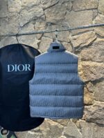 *Quality grade * with dust-proof bag packagingDior | DiorDior Jacquard Dark Pattern/Vest Down JacketDescription:This short Parker down is made of silk jacquard fabric, and the garment is filled with functional details to ensure warmth and care. Zipper pockets, adjustable cuffs with logo accents on the sleeves. Adding a unique and noble atmosphere to the overall design while significantly improving the protective performance.Material and process analysis:one ️⃣ Original silk dark jacquard patterntwo ️⃣ 90% plain duck down, the most abundant filling in the market, never blowing false goose down and a series of misunderstandingsthree ️⃣  Fabric: 100% nylon; Lining: 100% nylon, one of the top in the market, everything is customized according to the original version.four ⃣ The original processing factory produces electroplated hardware, all of which are custom-made by the original factory, and various replica versions are not available in the marketfive ⃣ Produced by a certain same generation factory, the quality has always been uncompromising. When it comes to large factories, everyone understands the craftsmanship of workers, and QA and Qc quality inspection are not comparable to small factories in the market.Dior down jackets, without boasting, there are hardly any that can do better than us at present!Make an original product with care, giving every customer the confidence to introduce themselves to the top tier replica version in China.A good product doesn't need too many soft articles to complement it,Only junk products will boast: the original ZP uses thousands of words to impress consumers with its scattered and overflowing content!Size: 46-54Color: Gray - Image 6