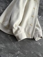 🆕- This woolen coat brings out the classic style with contemporary poetryWhen 72.1% sheep wool meets 27.9% polyester fiber, it weaves not only fabric, but also gentle armor that can withstand the test of time. The fleece surface has a fine luster, like a beach smoothed by the sea breeze. The light sand color will give off a warm luster like oatmeal Congee in the sun, and it will show the calm texture of gypsum sculpture in cloudy days.The arrangement of six buttons hides a thought-provoking rhythm - the four large buttons on the collar sound like piano accents, and the two small buttons on the hem sound like a light finish. This staggered design gives the placket a sense of rhythm amidst its regularity. The curve of the lapel is cut perfectly, which not only fits the collar shape of the shirt perfectly, but also outlines a graceful line when lifted in the wind.The round bottom patch pocket on the left chest is exquisitely crafted, with a curved bottom that makes the intervention posture more ergonomic. The slanted pockets on both sides have enough capacity to store hands, and the natural warmth of wool keeps fingertips warm even in cold winds. The most wonderful feature is the asymmetrical design of the cuffs - the outer knitted thread is windproof and warm, while the inner fabric continues the overall texture. The splicing details exposed when lifting the hand add a touch of fun.The one-piece cut on the back fully showcases the drape of the woolen fabric, and the hem forms smooth waves as you walk. The wine red lining inside is like a secret hidden in a suit, and the bright colors that catch a glimpse every time you take off are a small sense of ceremony unique to the wearer. The dual pocket design added to the side is both practical and considerate, allowing the phone and key to be placed separately without colliding with each other in the pocket.This jacket embodies the contemporary language of classic items, featuring a sturdy frame supported by polyester fibers, a soft and comfortable fit with plush wool, and asymmetrical cuffs for attention to detail. When others are still struggling with matching, this light sand colored jacket has already become the most sensible member in the wardrobe, easy to handle whether paired with jeans or trousers. In today's fast-paced fashion world, a wool jacket that can accompany you for many years but becomes even more flavorful is the true wardrobe cornerstone worth investing in.Color: Light Sand174-140 upper body size LSize: M-XXXL (48-56)Item number: FXHK8621M size bust circumference 114 shoulder width 47.8 sleeve length 60 garment length 62.5L size bust circumference 118 shoulder width 49 sleeve length 61.5 clothing length 64XL chest circumference 122 shoulder width 50.2 sleeve length 63 garment length 65.5XXL bust circumference 126 shoulder width 51.4 sleeve length 63.5 garment length 66.5XXXL bust circumference 130 shoulder width 52.6 sleeve length 64 garment length 67.5 - Image 6