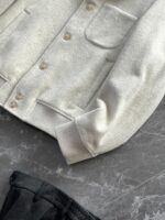 🆕- This woolen coat brings out the classic style with contemporary poetryWhen 72.1% sheep wool meets 27.9% polyester fiber, it weaves not only fabric, but also gentle armor that can withstand the test of time. The fleece surface has a fine luster, like a beach smoothed by the sea breeze. The light sand color will give off a warm luster like oatmeal Congee in the sun, and it will show the calm texture of gypsum sculpture in cloudy days.The arrangement of six buttons hides a thought-provoking rhythm - the four large buttons on the collar sound like piano accents, and the two small buttons on the hem sound like a light finish. This staggered design gives the placket a sense of rhythm amidst its regularity. The curve of the lapel is cut perfectly, which not only fits the collar shape of the shirt perfectly, but also outlines a graceful line when lifted in the wind.The round bottom patch pocket on the left chest is exquisitely crafted, with a curved bottom that makes the intervention posture more ergonomic. The slanted pockets on both sides have enough capacity to store hands, and the natural warmth of wool keeps fingertips warm even in cold winds. The most wonderful feature is the asymmetrical design of the cuffs - the outer knitted thread is windproof and warm, while the inner fabric continues the overall texture. The splicing details exposed when lifting the hand add a touch of fun.The one-piece cut on the back fully showcases the drape of the woolen fabric, and the hem forms smooth waves as you walk. The wine red lining inside is like a secret hidden in a suit, and the bright colors that catch a glimpse every time you take off are a small sense of ceremony unique to the wearer. The dual pocket design added to the side is both practical and considerate, allowing the phone and key to be placed separately without colliding with each other in the pocket.This jacket embodies the contemporary language of classic items, featuring a sturdy frame supported by polyester fibers, a soft and comfortable fit with plush wool, and asymmetrical cuffs for attention to detail. When others are still struggling with matching, this light sand colored jacket has already become the most sensible member in the wardrobe, easy to handle whether paired with jeans or trousers. In today's fast-paced fashion world, a wool jacket that can accompany you for many years but becomes even more flavorful is the true wardrobe cornerstone worth investing in.Color: Light Sand174-140 upper body size LSize: M-XXXL (48-56)Item number: FXHK8621M size bust circumference 114 shoulder width 47.8 sleeve length 60 garment length 62.5L size bust circumference 118 shoulder width 49 sleeve length 61.5 clothing length 64XL chest circumference 122 shoulder width 50.2 sleeve length 63 garment length 65.5XXL bust circumference 126 shoulder width 51.4 sleeve length 63.5 garment length 66.5XXXL bust circumference 130 shoulder width 52.6 sleeve length 64 garment length 67.5 - Image 9