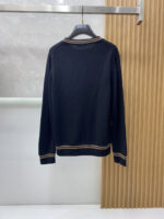 Prada wool blend knit sweater1. Wool and cashmere blended fabric:Selected high-quality wool and cashmere raw materials are blended in a certain proportion. Wool provides warmth and durability, while cashmere gives clothing a soft and delicate touch, making the fabric both comfortable and practical. Different from market products, our sweaters have a softer and more sticky texture2. Yarn preparationYarn dyeing and binding: Analyze the binding of yarn in the original version to ensure color reproduction and good color fastness.Yarn quality inspection: Conduct strict quality inspections on the yarn, including indicators such as line density, evenness, and moisture regain, to ensure that the yarn quality meets production standards.3. Knitted knittingUsing advanced knitting and weaving equipment to weave blended yarn into knitted shirts. During the weaving process, it is necessary to precisely control parameters such as knitting density and pattern changes to ensure the quality and appearance of the finished product. The precision of restoring the knight pattern4. Detail decoration and logo treatmentRibbed Knitted Decoration: Ribbed knitted decoration is used on the collar, cuffs, and hem of knitted shirts to enhance the beauty of details and make the clothing more in line with the body shape.Logo processing: Fix the Equestrian Knight logo (EKD) and Burberry lettering logo onto a knitted sweater through knitting. These logos enhance the recognition of clothing.5. Post sorting and inspectionShrinking treatment: Using the shrinking characteristics of cashmere fibers to shrink knitted sweaters.Ironing and shaping: Ironing knitwear to make it flatter, firmer, and maintain its style characteristics. Accurate temperature and pressure control is required during the ironing process to prevent clothing deformation or damage.Size: M-xxl - Image 8