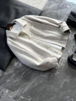 🆕- This woolen coat brings out the classic style with contemporary poetryWhen 72.1% sheep wool meets 27.9% polyester fiber, it weaves not only fabric, but also gentle armor that can withstand the test of time. The fleece surface has a fine luster, like a beach smoothed by the sea breeze. The light sand color will give off a warm luster like oatmeal Congee in the sun, and it will show the calm texture of gypsum sculpture in cloudy days.The arrangement of six buttons hides a thought-provoking rhythm - the four large buttons on the collar sound like piano accents, and the two small buttons on the hem sound like a light finish. This staggered design gives the placket a sense of rhythm amidst its regularity. The curve of the lapel is cut perfectly, which not only fits the collar shape of the shirt perfectly, but also outlines a graceful line when lifted in the wind.The round bottom patch pocket on the left chest is exquisitely crafted, with a curved bottom that makes the intervention posture more ergonomic. The slanted pockets on both sides have enough capacity to store hands, and the natural warmth of wool keeps fingertips warm even in cold winds. The most wonderful feature is the asymmetrical design of the cuffs - the outer knitted thread is windproof and warm, while the inner fabric continues the overall texture. The splicing details exposed when lifting the hand add a touch of fun.The one-piece cut on the back fully showcases the drape of the woolen fabric, and the hem forms smooth waves as you walk. The wine red lining inside is like a secret hidden in a suit, and the bright colors that catch a glimpse every time you take off are a small sense of ceremony unique to the wearer. The dual pocket design added to the side is both practical and considerate, allowing the phone and key to be placed separately without colliding with each other in the pocket.This jacket embodies the contemporary language of classic items, featuring a sturdy frame supported by polyester fibers, a soft and comfortable fit with plush wool, and asymmetrical cuffs for attention to detail. When others are still struggling with matching, this light sand colored jacket has already become the most sensible member in the wardrobe, easy to handle whether paired with jeans or trousers. In today's fast-paced fashion world, a wool jacket that can accompany you for many years but becomes even more flavorful is the true wardrobe cornerstone worth investing in.Color: Light Sand174-140 upper body size LSize: M-XXXL (48-56)Item number: FXHK8621M size bust circumference 114 shoulder width 47.8 sleeve length 60 garment length 62.5L size bust circumference 118 shoulder width 49 sleeve length 61.5 clothing length 64XL chest circumference 122 shoulder width 50.2 sleeve length 63 garment length 65.5XXL bust circumference 126 shoulder width 51.4 sleeve length 63.5 garment length 66.5XXXL bust circumference 130 shoulder width 52.6 sleeve length 64 garment length 67.5 - Image 2