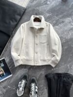 🆕- This woolen coat brings out the classic style with contemporary poetryWhen 72.1% sheep wool meets 27.9% polyester fiber, it weaves not only fabric, but also gentle armor that can withstand the test of time. The fleece surface has a fine luster, like a beach smoothed by the sea breeze. The light sand color will give off a warm luster like oatmeal Congee in the sun, and it will show the calm texture of gypsum sculpture in cloudy days.The arrangement of six buttons hides a thought-provoking rhythm - the four large buttons on the collar sound like piano accents, and the two small buttons on the hem sound like a light finish. This staggered design gives the placket a sense of rhythm amidst its regularity. The curve of the lapel is cut perfectly, which not only fits the collar shape of the shirt perfectly, but also outlines a graceful line when lifted in the wind.The round bottom patch pocket on the left chest is exquisitely crafted, with a curved bottom that makes the intervention posture more ergonomic. The slanted pockets on both sides have enough capacity to store hands, and the natural warmth of wool keeps fingertips warm even in cold winds. The most wonderful feature is the asymmetrical design of the cuffs - the outer knitted thread is windproof and warm, while the inner fabric continues the overall texture. The splicing details exposed when lifting the hand add a touch of fun.The one-piece cut on the back fully showcases the drape of the woolen fabric, and the hem forms smooth waves as you walk. The wine red lining inside is like a secret hidden in a suit, and the bright colors that catch a glimpse every time you take off are a small sense of ceremony unique to the wearer. The dual pocket design added to the side is both practical and considerate, allowing the phone and key to be placed separately without colliding with each other in the pocket.This jacket embodies the contemporary language of classic items, featuring a sturdy frame supported by polyester fibers, a soft and comfortable fit with plush wool, and asymmetrical cuffs for attention to detail. When others are still struggling with matching, this light sand colored jacket has already become the most sensible member in the wardrobe, easy to handle whether paired with jeans or trousers. In today's fast-paced fashion world, a wool jacket that can accompany you for many years but becomes even more flavorful is the true wardrobe cornerstone worth investing in.Color: Light Sand174-140 upper body size LSize: M-XXXL (48-56)Item number: FXHK8621M size bust circumference 114 shoulder width 47.8 sleeve length 60 garment length 62.5L size bust circumference 118 shoulder width 49 sleeve length 61.5 clothing length 64XL chest circumference 122 shoulder width 50.2 sleeve length 63 garment length 65.5XXL bust circumference 126 shoulder width 51.4 sleeve length 63.5 garment length 66.5XXXL bust circumference 130 shoulder width 52.6 sleeve length 64 garment length 67.5 - Image 3