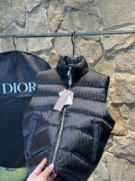 *Quality grade * with dust-proof bag packagingDior | DiorDior Jacquard Dark Pattern/Vest Down JacketDescription:This short Parker down is made of silk jacquard fabric, and the garment is filled with functional details to ensure warmth and care. Zipper pockets, adjustable cuffs with logo accents on the sleeves. Adding a unique and noble atmosphere to the overall design while significantly improving the protective performance.Material and process analysis:one ️⃣ Original silk dark jacquard patterntwo ️⃣ 90% plain duck down, the most abundant filling in the market, never blowing false goose down and a series of misunderstandingsthree ️⃣  Fabric: 100% nylon; Lining: 100% nylon, one of the top in the market, everything is customized according to the original version.four ⃣ The original processing factory produces electroplated hardware, all of which are custom-made by the original factory, and various replica versions are not available in the marketfive ⃣ Produced by a certain same generation factory, the quality has always been uncompromising. When it comes to large factories, everyone understands the craftsmanship of workers, and QA and Qc quality inspection are not comparable to small factories in the market.Dior down jackets, without boasting, there are hardly any that can do better than us at present!Make an original product with care, giving every customer the confidence to introduce themselves to the top tier replica version in China.A good product doesn't need too many soft articles to complement it,Only junk products will boast: the original ZP uses thousands of words to impress consumers with its scattered and overflowing content!Size: 46-54Color: Black - Image 4