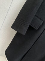 TF Tom Ford 2025 Autumn/Winter Men's Cashmere Coat: Defining Elegant Style with IngenuityOn the advanced path of autumn and winter wardrobes, a coat that combines texture and design is the core item that interprets taste. Tom Ford's new men's cashmere coat for autumn and winter 2025 continues the brand's commitment to luxury aesthetics, blending superior materials with exquisite tailoring to create a classic dressing choice for contemporary men that transcends occasions.The fabric serves as the cornerstone of texture, and this coat is made from imported Australian cashmere wool, sourced from high-quality Merino sheep wool fibers in Australia. The diameter is delicate and naturally curly, and after exquisite craftsmanship, it is woven into a fabric that combines a soft and skin friendly touch with excellent warmth. This fabric not only has excellent drape and can naturally fit the body's lines, but also has good wrinkle resistance and moisture wicking ability. Even in dry autumn and winter, it can maintain a comfortable and firm wearing experience.In terms of design, the mid to long silhouette balances warmth and body shaping effects, with a length that covers the hips perfectly, avoiding the thinness of the short silhouette and eliminating the need to worry about the drag of the long silhouette, making it suitable for various body types. The highlight is the back waistband design, which continues Tom Ford's precise control of line balance - presenting a relaxed and elegant casual posture when loosened, and outlining a sharp waistline when fastened, breaking the dullness of traditional coats and hiding design ingenuity in the minimalist silhouette.From formal attire for business commuting to casual wear for casual occasions, this coat can seamlessly adapt. Paired with a shirt and trousers, it is a low-key and introverted workplace style; Paired with a knitted sweater and casual pants, it reveals a calm and composed daily taste. The design language without exaggerated logos is precisely the embodiment of the brand's "low-key luxury" concept, making texture the best business card.Tom Ford's men's cashmere coat for autumn and winter 2025, with the natural luxury of Australian cashmere wool as the bone and the exquisite design of the back and waist as the soul, creates a wardrobe collection that can travel through time.Size: M-3XL - Image 6