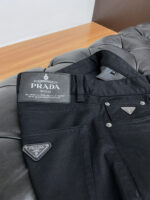 Prada's new spring/summer 2025 casual pants are cleanly cut, with a strong urban style. They are made of finely spun pure cotton fabric, which feels soft, sticky, and dry to the touch. The upper body effect is crisp and stylish. Exquisite hardware, very attractive for business and leisure. With so many top-notch materials, it creates a high-end product with unparalleled value, which is the first choice for high-end trendy and fashionable peopleSize: 30-38 - Image 5