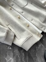 🆕- This woolen coat brings out the classic style with contemporary poetryWhen 72.1% sheep wool meets 27.9% polyester fiber, it weaves not only fabric, but also gentle armor that can withstand the test of time. The fleece surface has a fine luster, like a beach smoothed by the sea breeze. The light sand color will give off a warm luster like oatmeal Congee in the sun, and it will show the calm texture of gypsum sculpture in cloudy days.The arrangement of six buttons hides a thought-provoking rhythm - the four large buttons on the collar sound like piano accents, and the two small buttons on the hem sound like a light finish. This staggered design gives the placket a sense of rhythm amidst its regularity. The curve of the lapel is cut perfectly, which not only fits the collar shape of the shirt perfectly, but also outlines a graceful line when lifted in the wind.The round bottom patch pocket on the left chest is exquisitely crafted, with a curved bottom that makes the intervention posture more ergonomic. The slanted pockets on both sides have enough capacity to store hands, and the natural warmth of wool keeps fingertips warm even in cold winds. The most wonderful feature is the asymmetrical design of the cuffs - the outer knitted thread is windproof and warm, while the inner fabric continues the overall texture. The splicing details exposed when lifting the hand add a touch of fun.The one-piece cut on the back fully showcases the drape of the woolen fabric, and the hem forms smooth waves as you walk. The wine red lining inside is like a secret hidden in a suit, and the bright colors that catch a glimpse every time you take off are a small sense of ceremony unique to the wearer. The dual pocket design added to the side is both practical and considerate, allowing the phone and key to be placed separately without colliding with each other in the pocket.This jacket embodies the contemporary language of classic items, featuring a sturdy frame supported by polyester fibers, a soft and comfortable fit with plush wool, and asymmetrical cuffs for attention to detail. When others are still struggling with matching, this light sand colored jacket has already become the most sensible member in the wardrobe, easy to handle whether paired with jeans or trousers. In today's fast-paced fashion world, a wool jacket that can accompany you for many years but becomes even more flavorful is the true wardrobe cornerstone worth investing in.Color: Light Sand174-140 upper body size LSize: M-XXXL (48-56)Item number: FXHK8621M size bust circumference 114 shoulder width 47.8 sleeve length 60 garment length 62.5L size bust circumference 118 shoulder width 49 sleeve length 61.5 clothing length 64XL chest circumference 122 shoulder width 50.2 sleeve length 63 garment length 65.5XXL bust circumference 126 shoulder width 51.4 sleeve length 63.5 garment length 66.5XXXL bust circumference 130 shoulder width 52.6 sleeve length 64 garment length 67.5 - Image 8